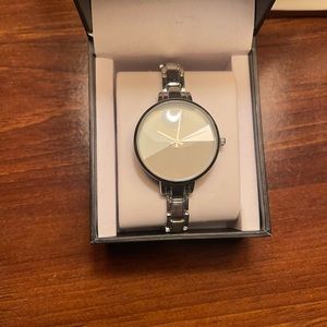 Inc watch with silver band